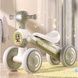 Біговел дитячий чотириколісний зі світловими та музичними ефектами JOY TR-89302 Білий з оливковим