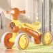 Біговел дитячий чотириколісний зі світловими та музичними ефектами JOY TR-90018 Жовтий з помаранчевим